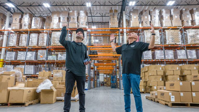 Two TCB employees look to the heavens to consider how Beverage distribution Logistics have changed due to AI