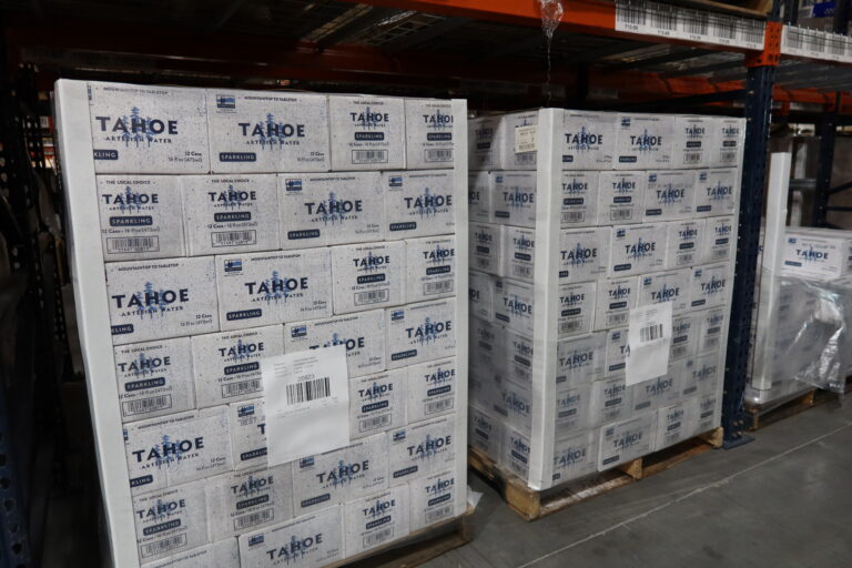 Stacks of pallets of drinks, ready move through a Beverage Logistics pipeline.