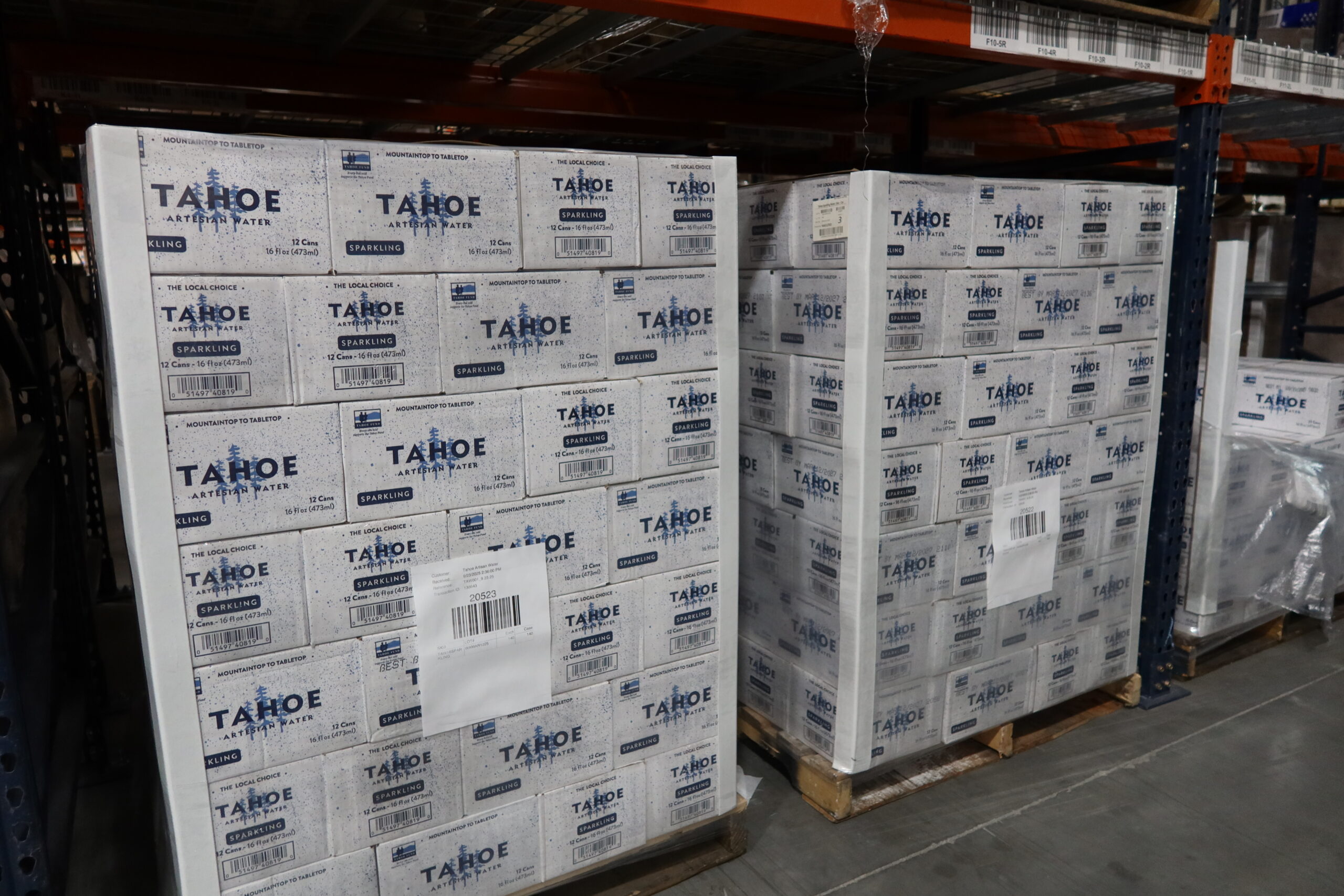 Stacks of pallets of drinks, ready move through a Beverage Logistics pipeline.