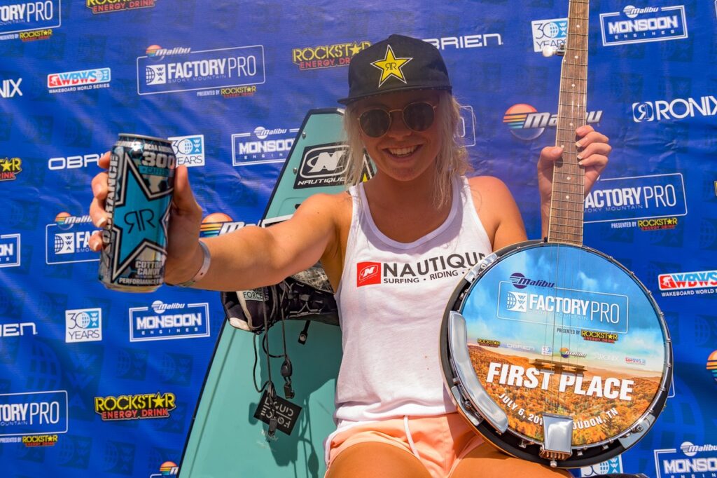 A woman on the Rockstar Stage, benefiting from TCB's Beverage Logistics