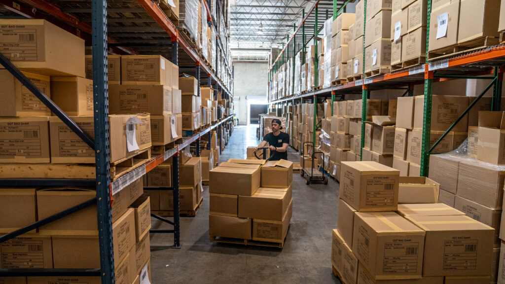 A warehouse full of boxes of cans, ready for an effective beverage fulfillment pipeline