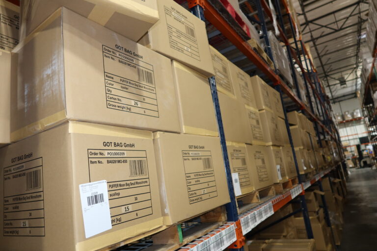 Stacks of boxes in our TCB warehouse, ready for freight transportation services.