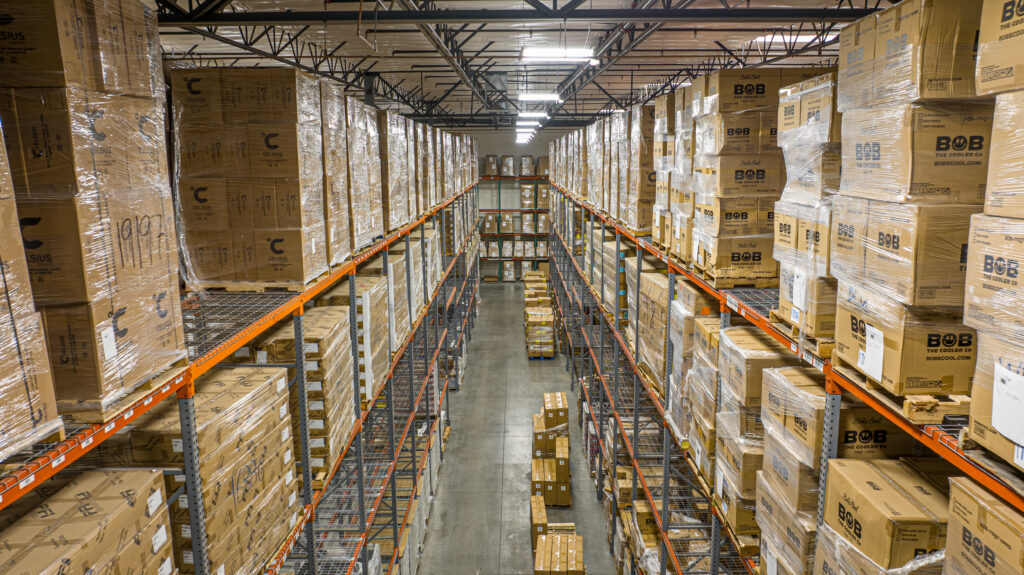 Isles of boxes at one of our warehouses, used in Bi-Coastal Fulfillment Strategy