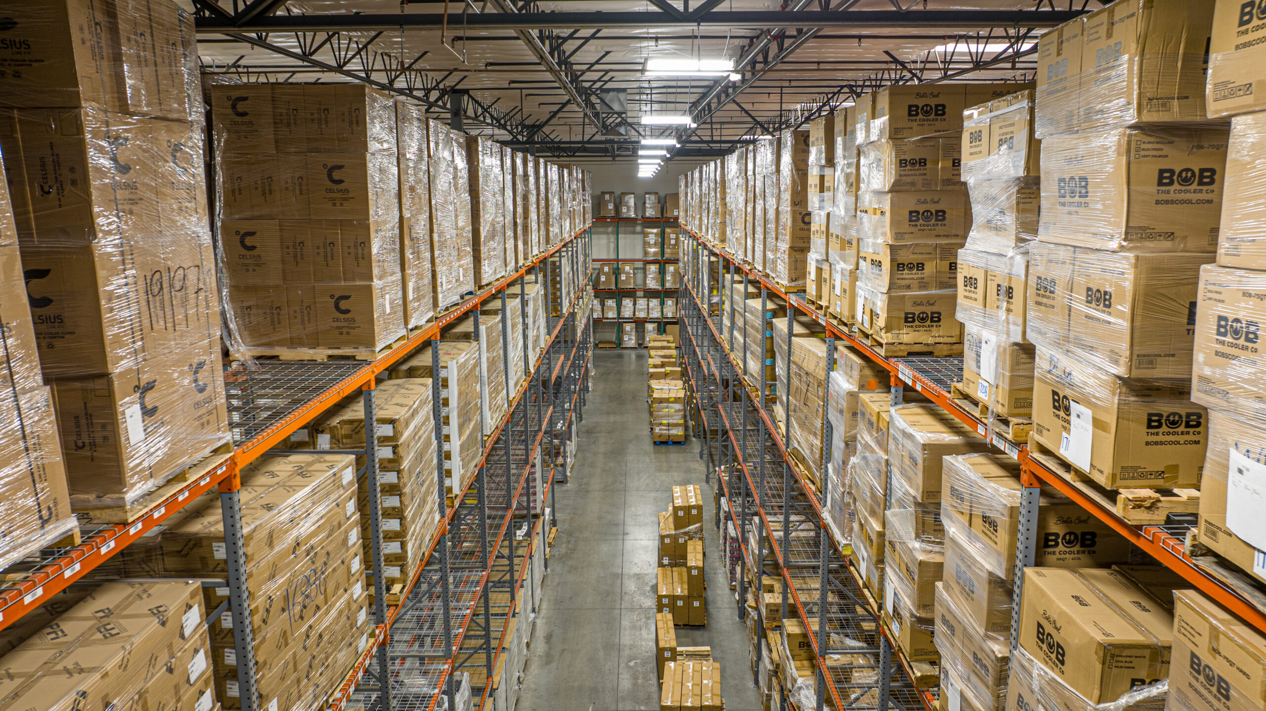 Isles of boxes at one of our warehouses, used in Bi-Coastal Fulfillment Strategy