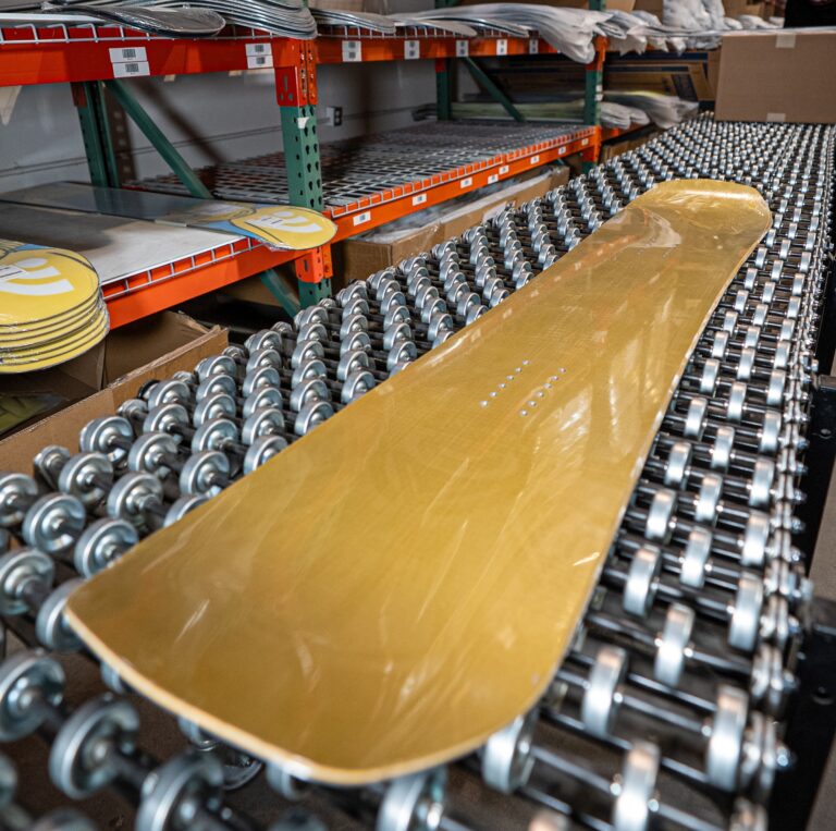 A Signal Snowboard in a TCB Warehouse ready for a premium fulfillment process.