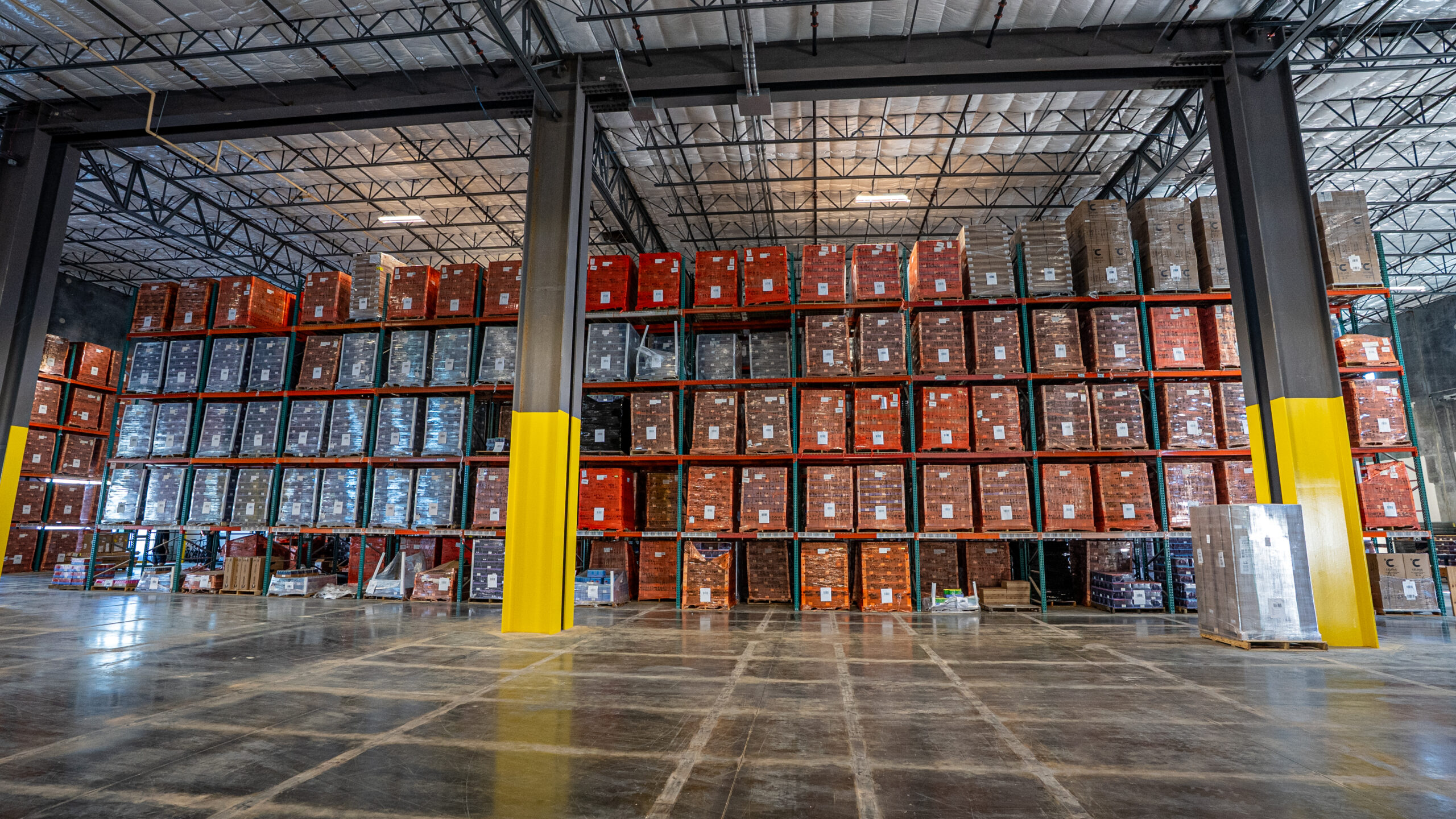 A wall of pallets ready for Beverage Logistics Solutions.