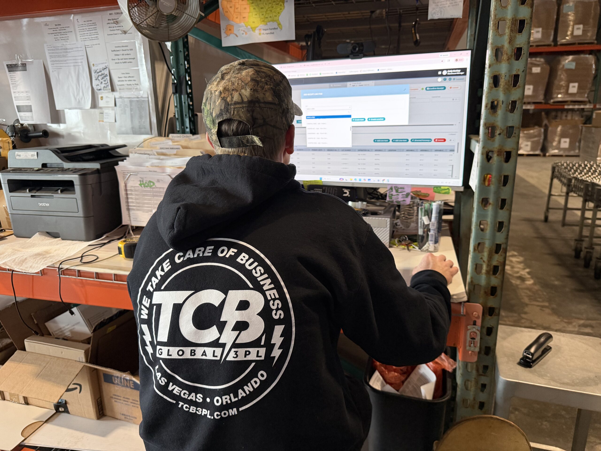 A TCB Employee working on supply chain management.