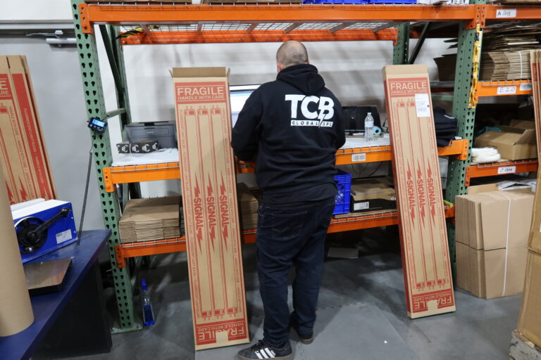 A TCB worker working to prevent fulfillment delays