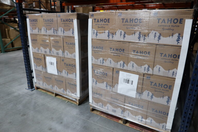 Pallets of Tahoe cans ready for scaling beverage distribution services.